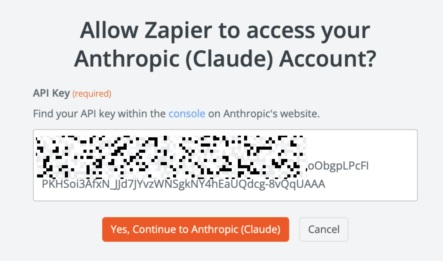 A window inside Zapier with a field to enter an API key, plus buttons to cancel or proceed