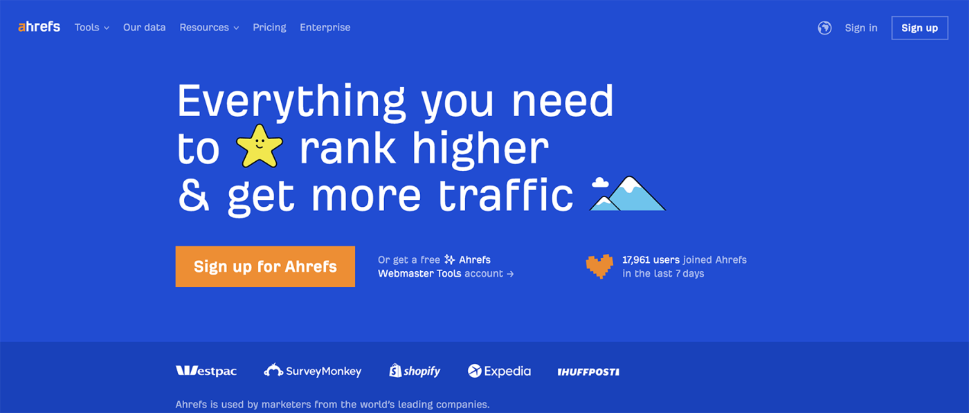 Screenshot of the header on Ahrefs' homepage that says "Everything you need to rank higher and get more traffic" on a blue background