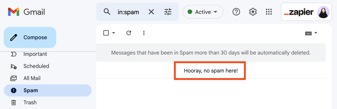 Portion of Spam folder in Gmail inbox. The folder is empty with a message that reads "Hooray, no spam here!"