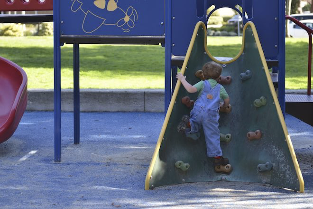 Kid climbing on a playground