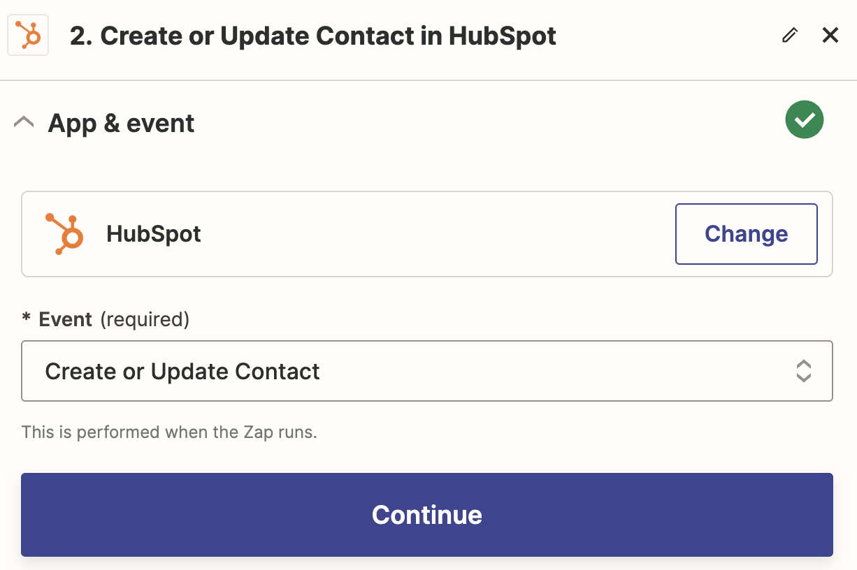 An action step in the Zap editor with HubSpot selected for the action app and Create or Update Contact selected for the action event.
