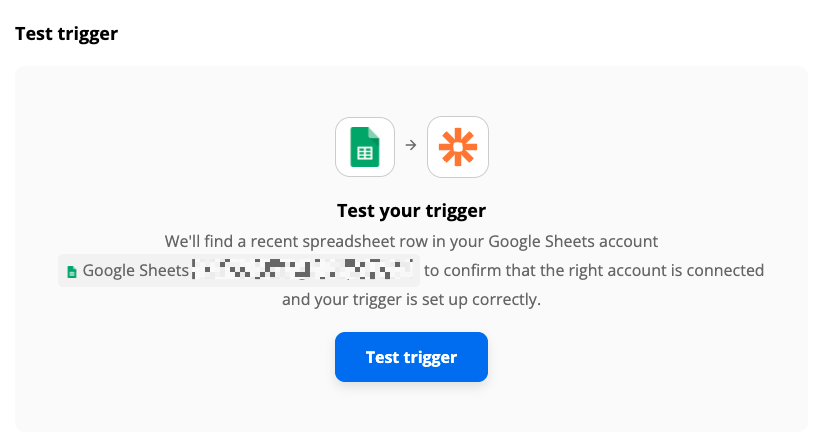 A test screen with the Google Sheets app logo connected to the Zapier app logo with an arrow. 