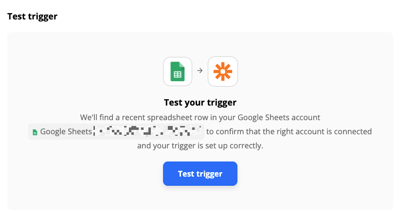 A test screen with the Google Sheets app logo connected to the Zapier app logo with an arrow. 