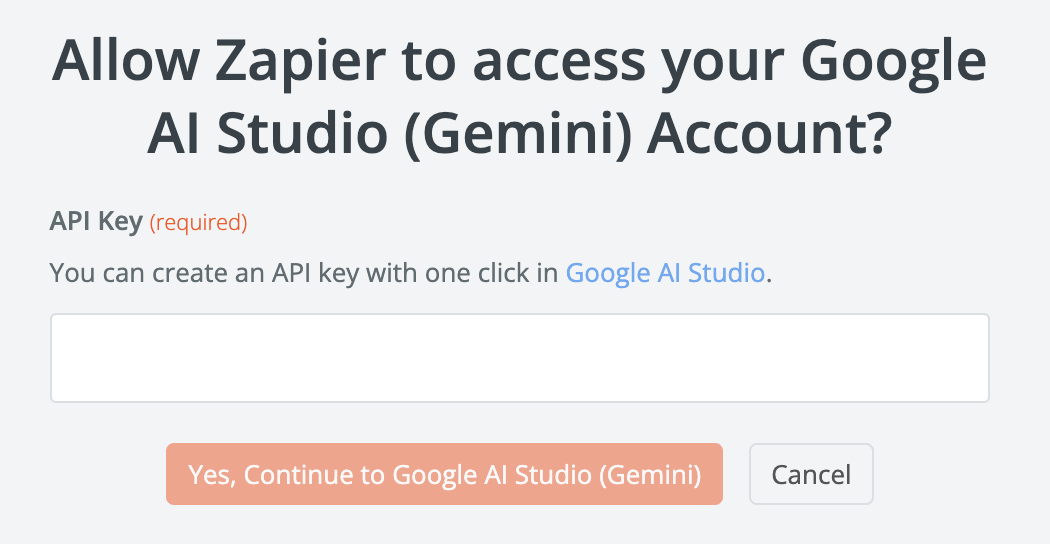 API 키 필드와 주황색을 사용하여 Zapier에게 Google AI Studio 계정에 대한 액세스를 허용하도록 요청하는 대화 상자 "계속하다" 단추