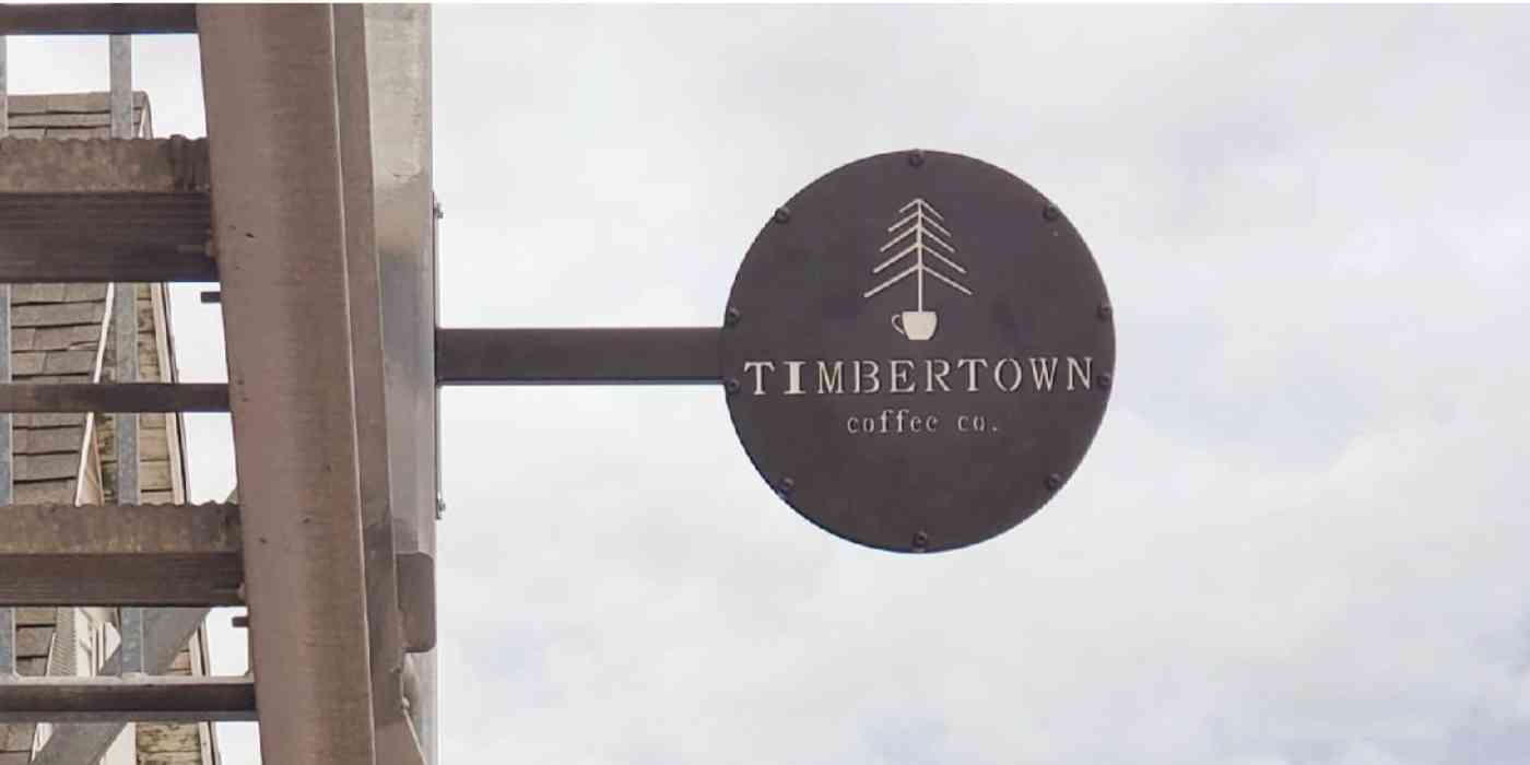 A hero image of the Timbertown Coffee sign