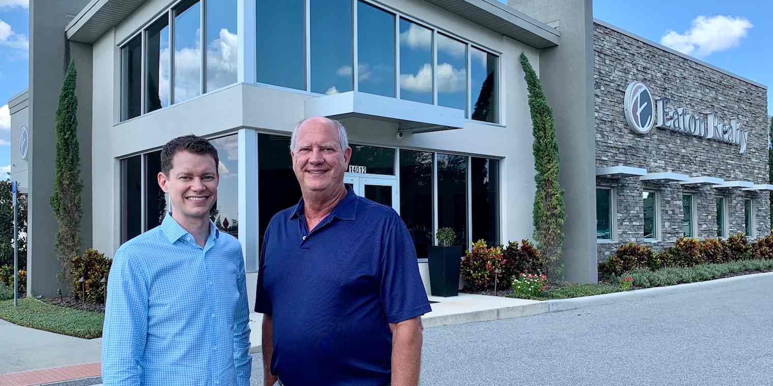 Hero image of two men in front of Eaton Realty