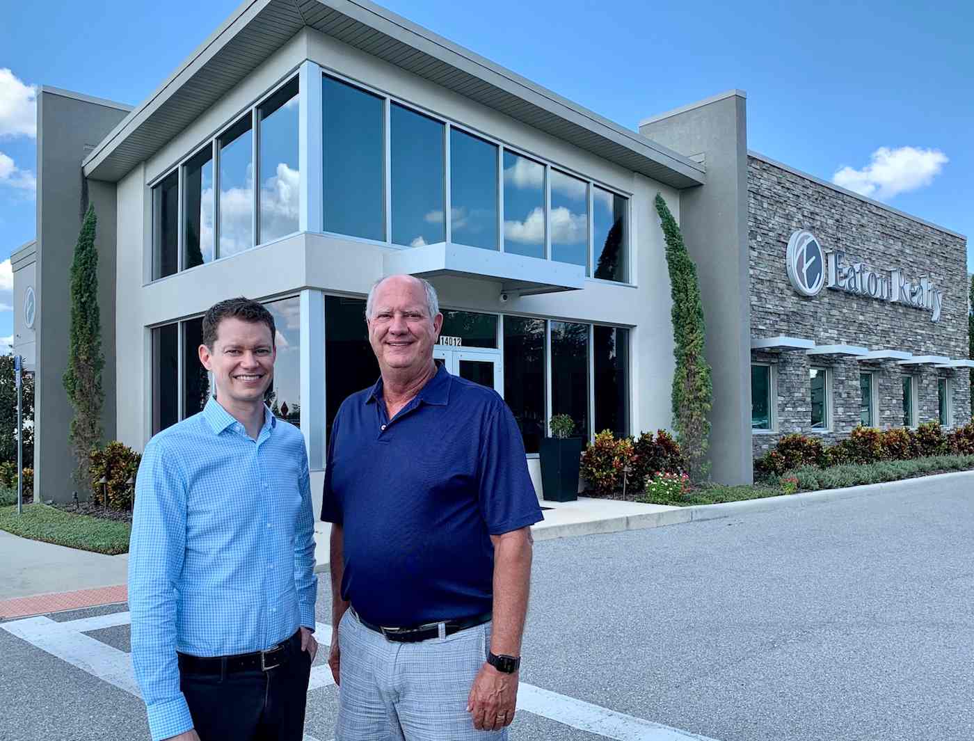 Hero image of two men in front of Eaton Realty