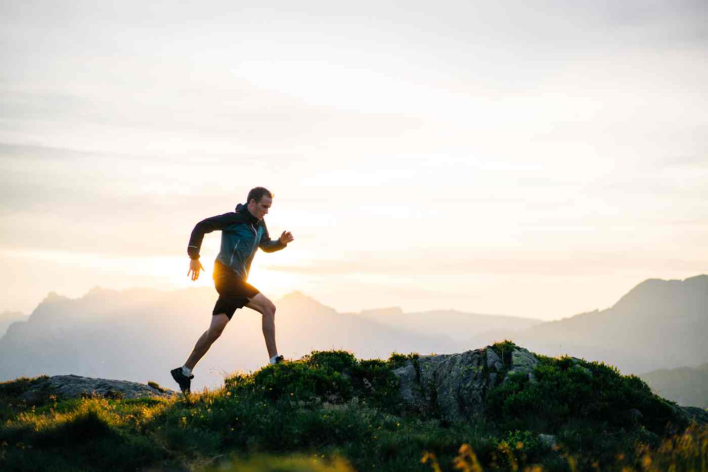 Man running on rocky hill