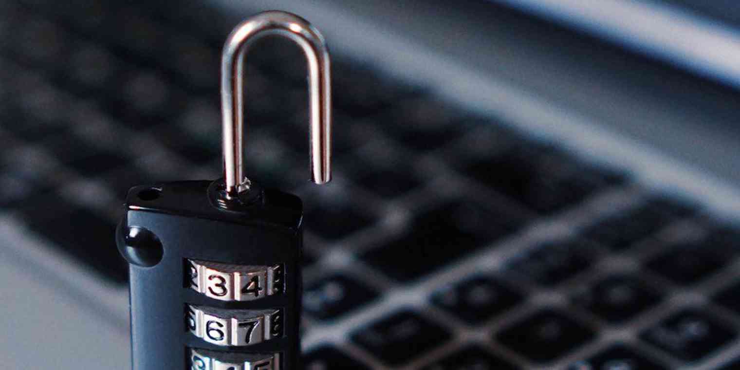 A lock in front of a laptop