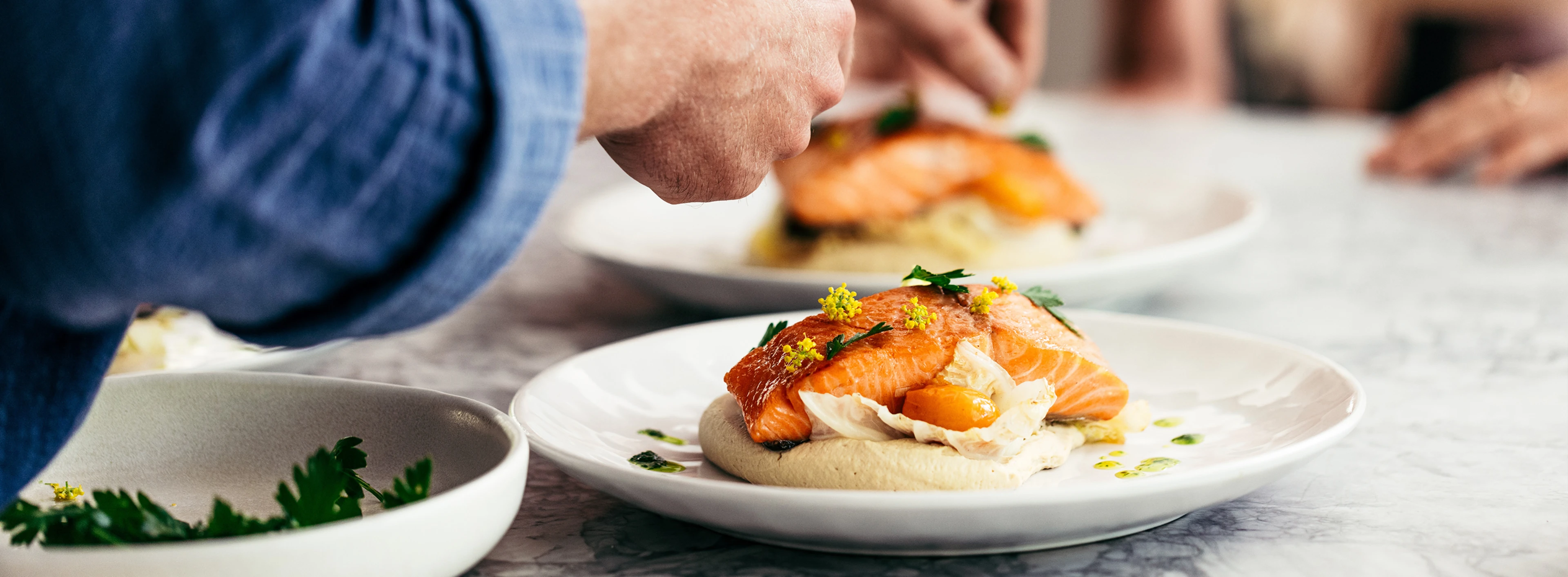 Chef Preparing Baked Salmon Portions