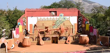 Discover Udaipur's artistic treasures with TravelTaxi - The vibrant Shilpgram Crafts Village.