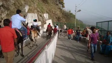 Unwind in Vaishno Devi's serene landscapes with TravelTaxi - The tranquil Adhkuwari.