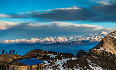 Unwind in Nepal's serene landscapes with TravelTaxi - The tranquil Phewa Lake in Pokhara.