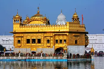 Embrace Amritsar's spiritual essence with TravelTaxi - The serene Sarovar at the Golden Temple.