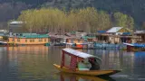 Experience serenity on Dal Lake with TravelTaxi's guided shikara rides in Srinagar, Kashmir.