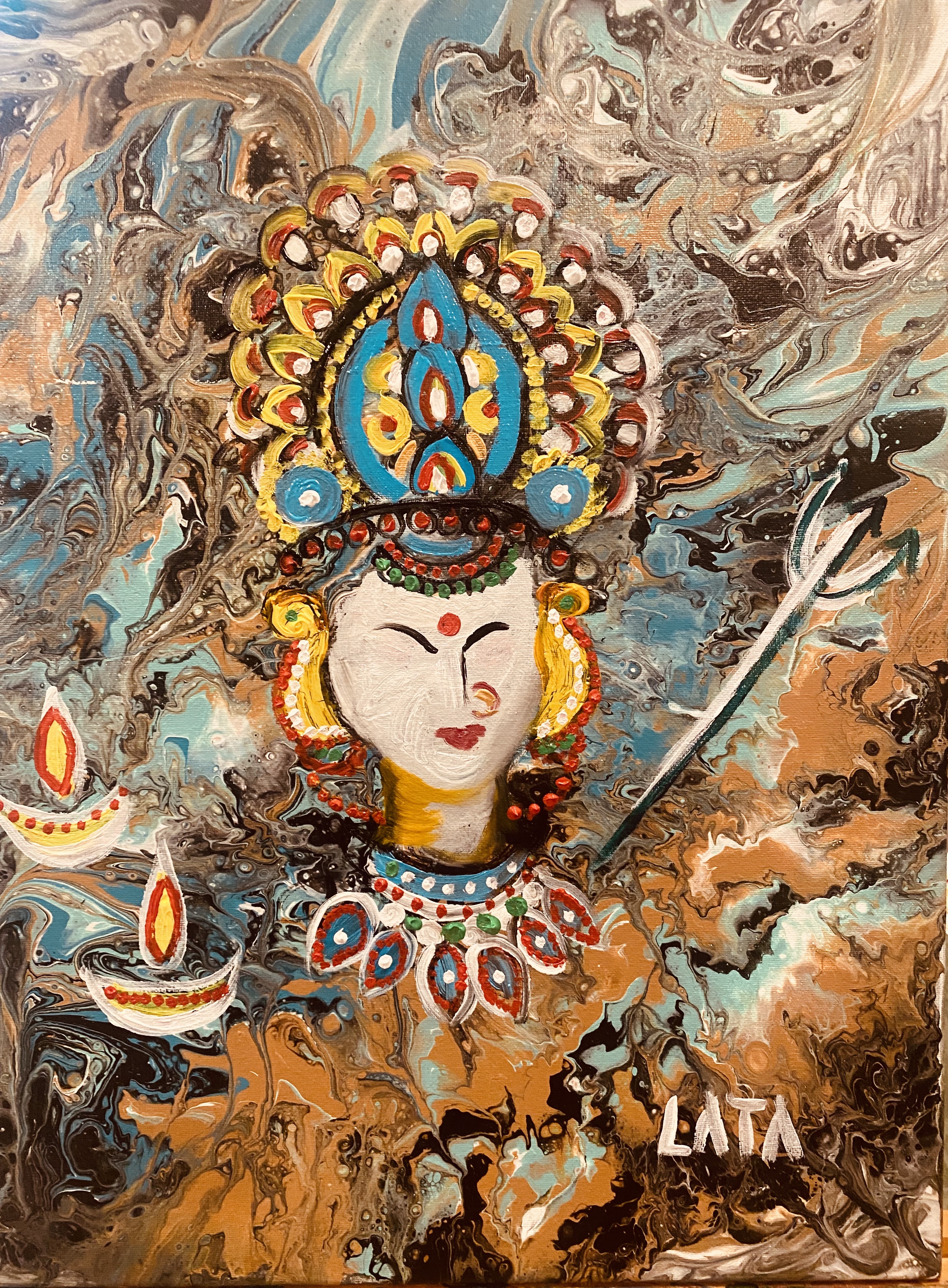 This striking artwork, titled *"Divine Grace"*, presents a vivid and imaginative portrayal of Goddess Durga, a symbol of power, protection, and divine energy in Hindu mythology. The artist skillfully blends traditional iconography with modern artistic techniques, creating a piece that feels both timeless and contemporary.

The swirling, marbled background evokes a cosmic energy, representing the chaos from which Durga emerges as the ultimate force of order and strength. Her serene yet powerful visage is adorned with an intricately detailed crown, echoing divine regality. The vibrant blues, yellows, and reds in the headpiece and jewelry not only symbolize prosperity and valor but also create a captivating contrast against the muted, earthy tones of the background.

The inclusion of diyas, radiating warmth and light, serves as a homage to Durga’s role as a guiding force amidst darkness, while the trident in the frame subtly reinforces her role as the vanquisher of evil. The artist’s signature in the lower corner is a subtle yet personal touch, anchoring this celestial depiction with a human connection.

What sets this piece apart is the balance of abstraction and detail. The swirling textures and fluid motion of the background create a sense of dynamic energy, while the precision in Durga's adornments draws the viewer into the intricate beauty of her form.

*Divine Grace* is not just a painting; it is a visual hymn that celebrates the resilience, courage, and divine spirit embodied by Durga. This piece would resonate deeply with viewers who appreciate art as a medium for cultural and spiritual storytelling, making it a compelling addition to any gallery or collection.