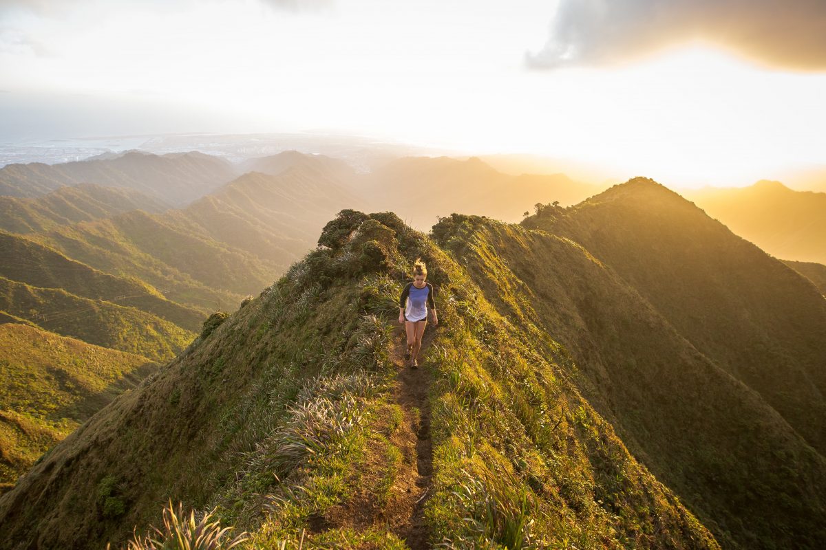 A woman walking on a mountain