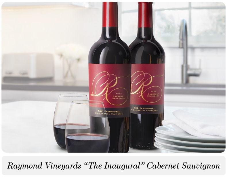 Two bottles and two glasses of Raymond Vineyards "The Inaugural" Cabernet Sauvignon