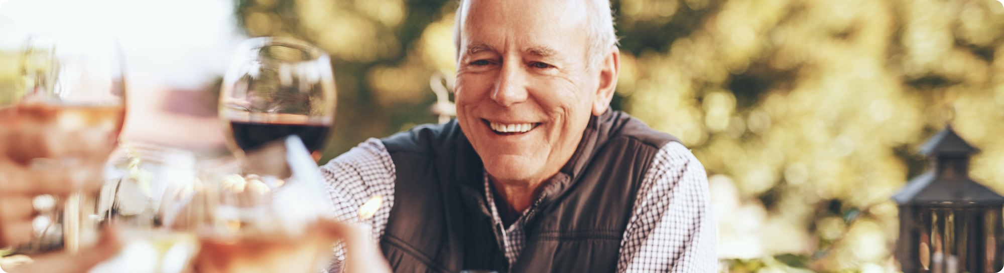 Man celebrating Father's Day with a glass of wine
