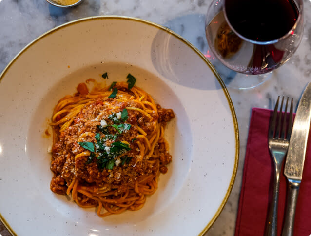 A hearty pasta dish with beef ragù pairs well with Malbec wine