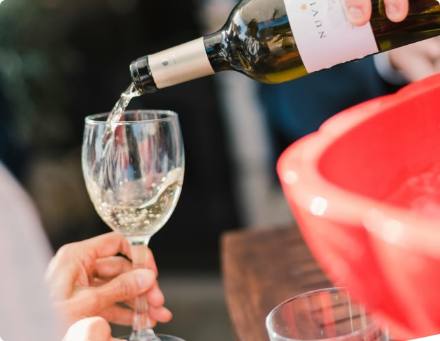 Pouring a glass of white wine