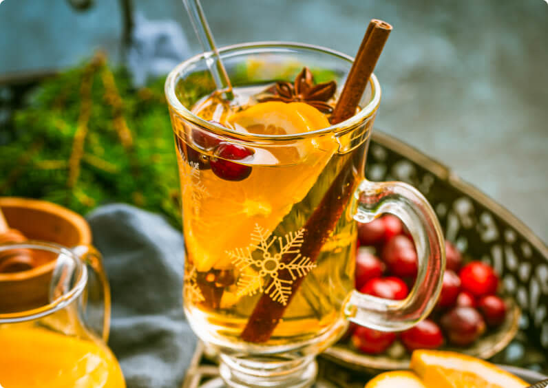 A glass mug filled with mulled white wine