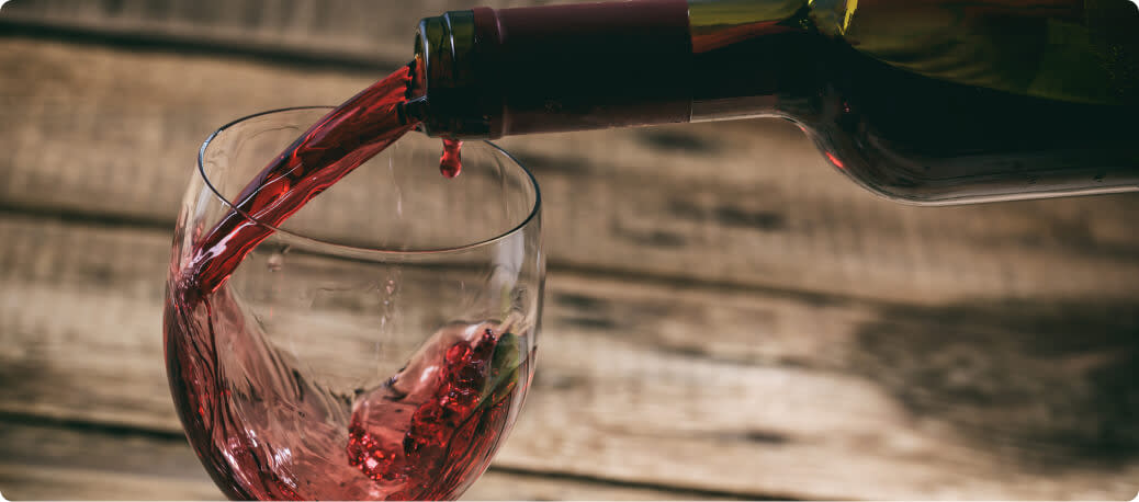 Pouring a glass of dry red wine
