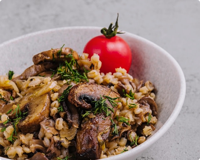 Vegan grain bowl with charred mushrooms