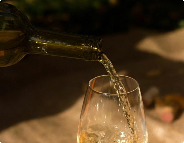 Pouring a glass of moscato white wine