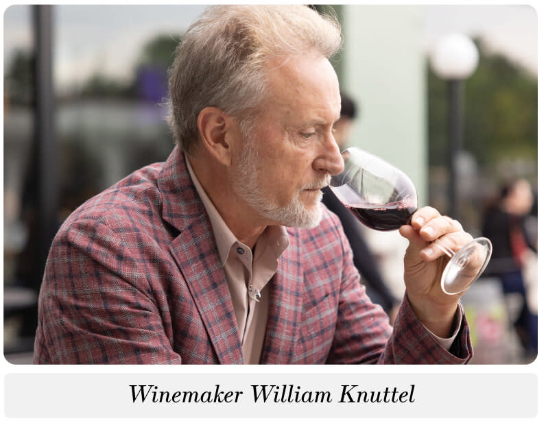Winemaker William Knuttel smelling a glass of red wine