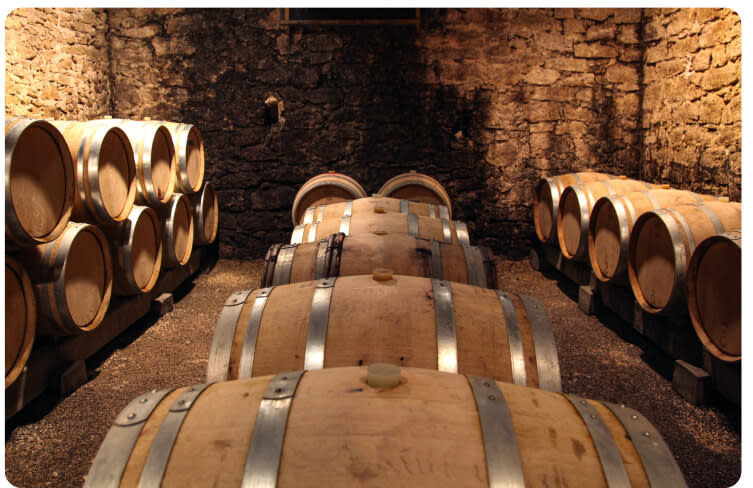 Oak barrels for aging wine in a cellar