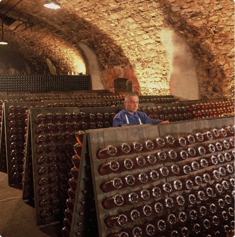 Man making champagne using the traditional method