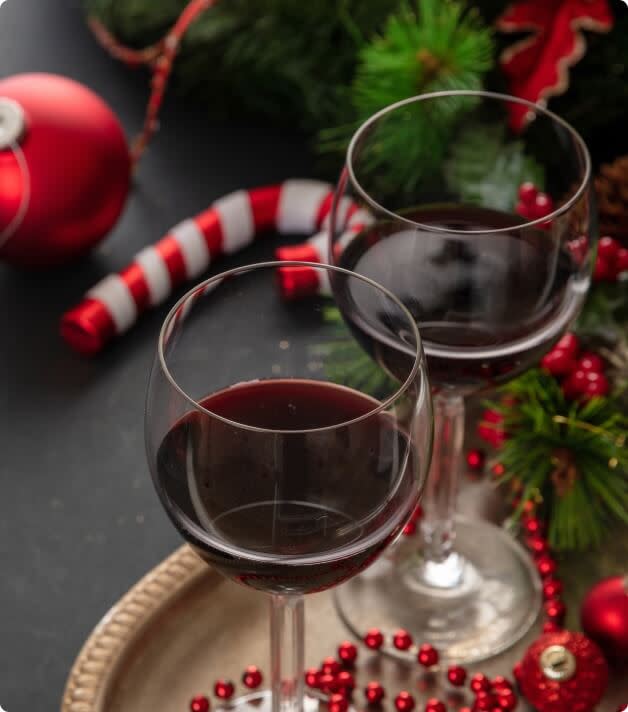 Two glasses of red wine served at Christmas dinner