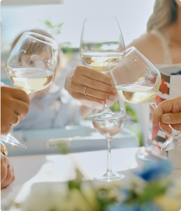 Toasting with white wine at a wedding reception