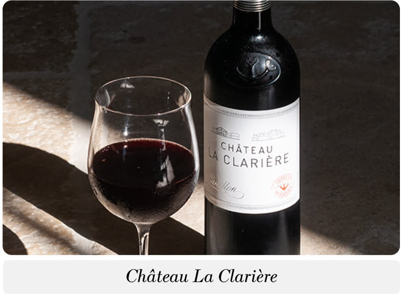 A bottle and glass of Château La Clarière Bordeaux wine