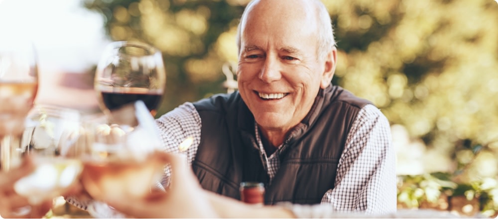 Man celebrating Father's Day with a glass of wine