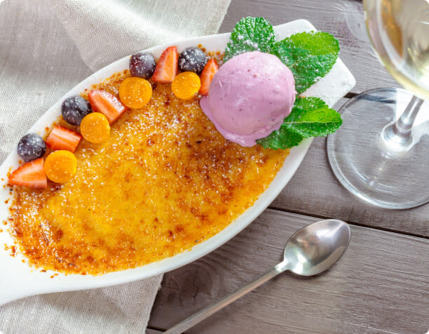 Creme brûlée with a glass of Chardonnay wine