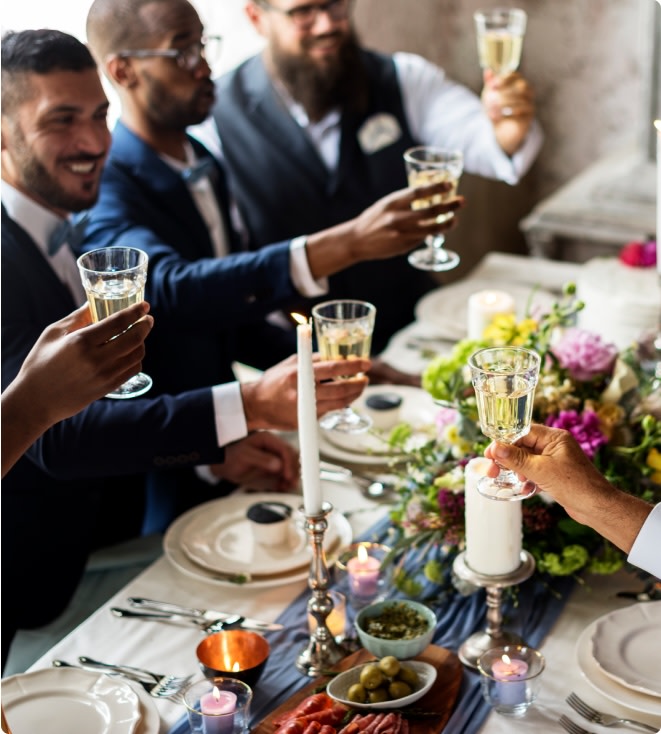 Wedding guests toasting with white wine