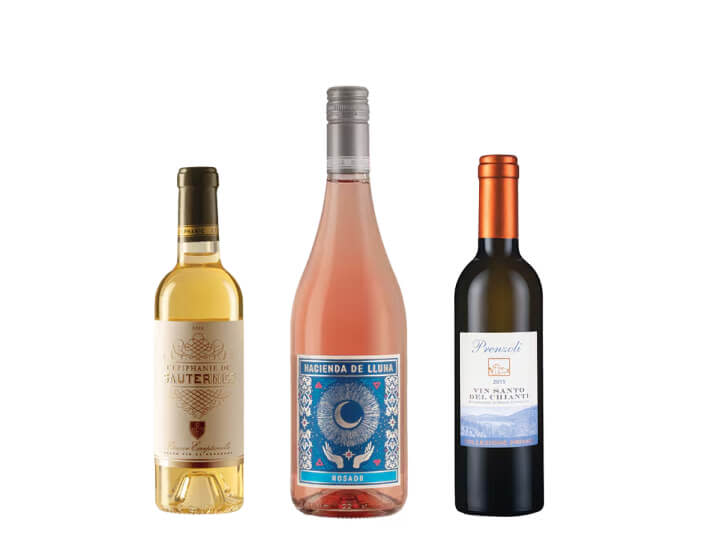 Three bottles of sweet wine on a blank background