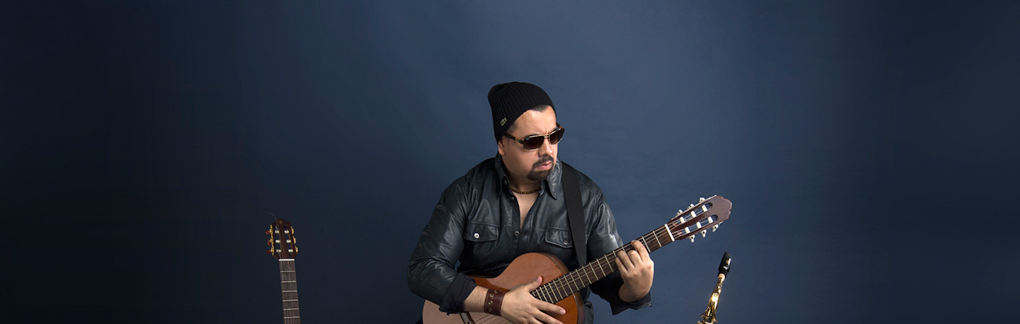 Romulo Delgado, a world-class tenor leading an ensemble known for his virtuosity and fiery acoustic rhythms.