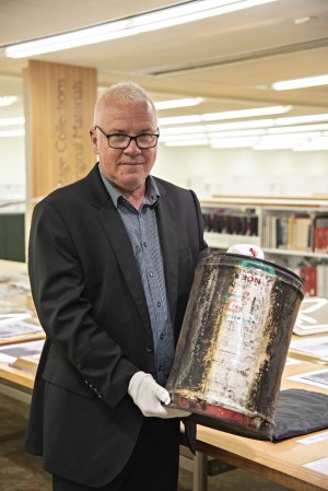 Matthew Condon with the fuel drums from the Whiskey firebombing.