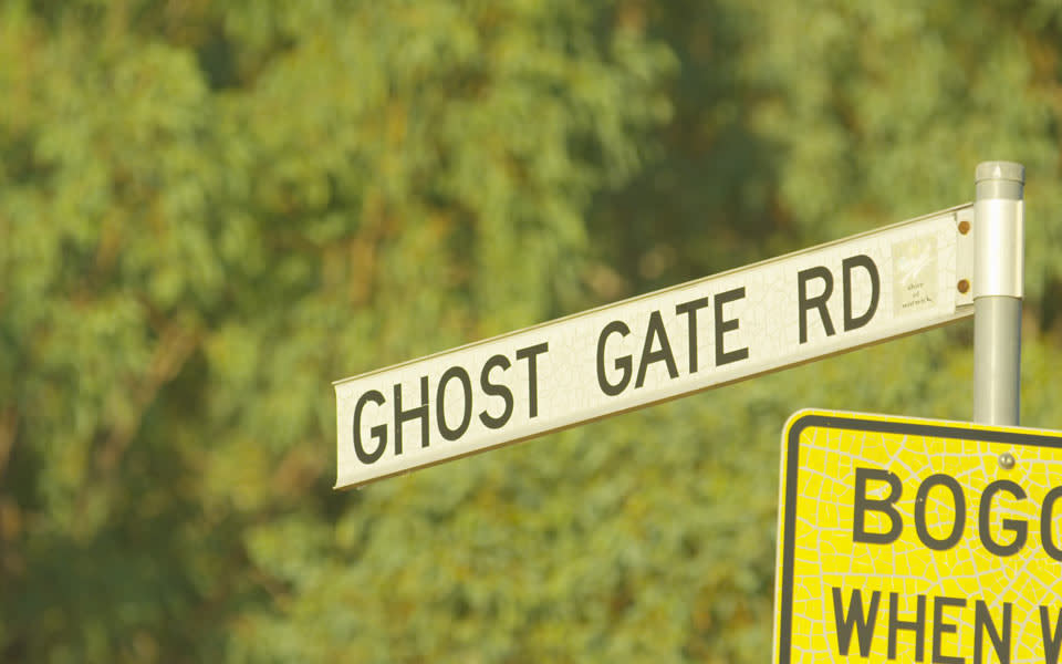 The road sign for Ghost Gate Road