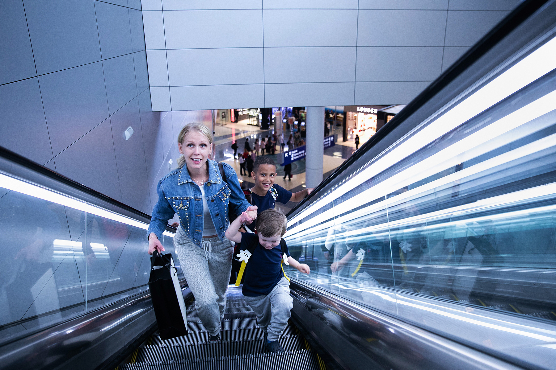 Travelers on Escalator