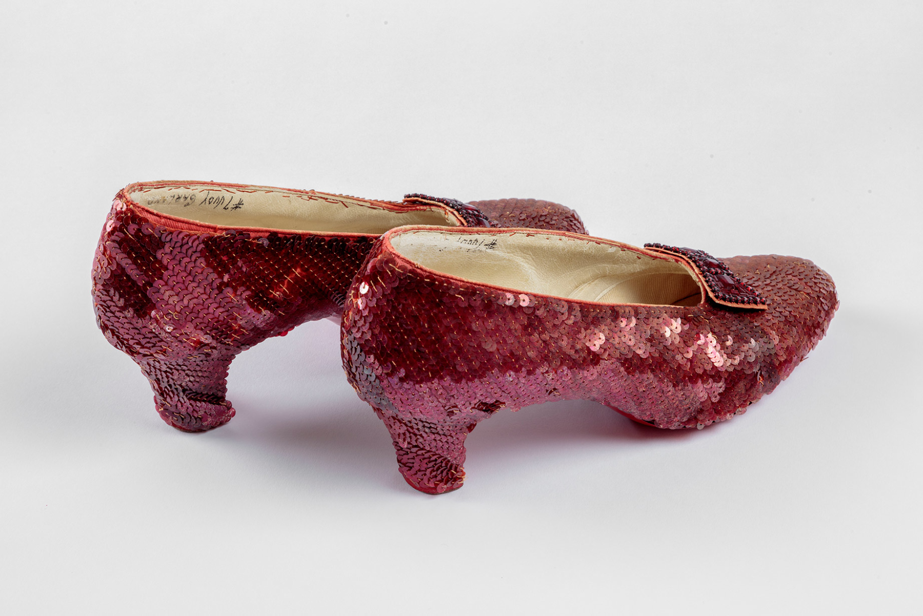 Screen-used close-up pair of the Ruby Slippers, designed by Adrian, from "The Wizard of Oz" (1939). Academy Museum of Motion Pictures. Photo by Joshua White, JWPictures/©Academy Museum Foundation