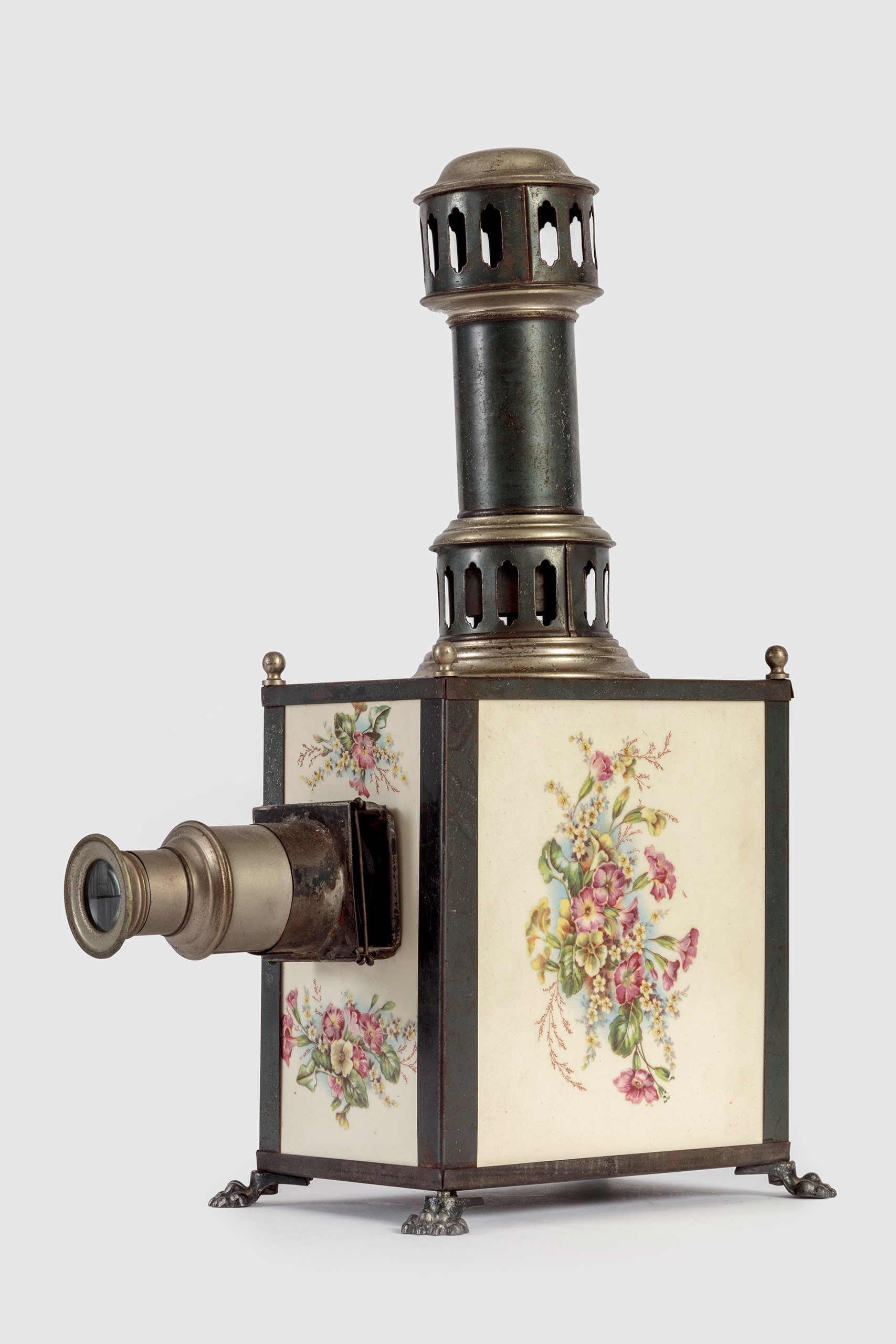 Magic Lantern, Johann Falk, Steel, paint, transfer print on ceramic, brass, and glass, 1895, Nuremberg, Germany, from the Richard Balzer Collection, gift of Patricia Bellinger Balzer, Photo by Joshua White/JW Pictures, ©Academy Museum Foundation