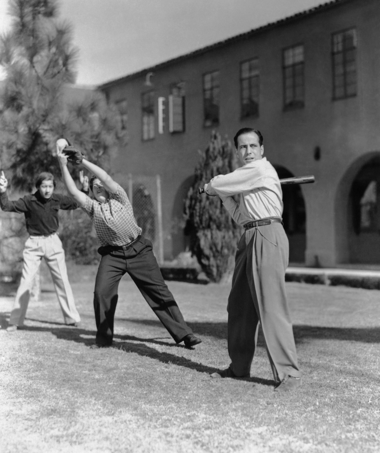 Bobby Jordan (back), Bernard Punsly (middle), and Humphrey Bogart (front) between filming scenes of Crime School (1938), Everett Collection