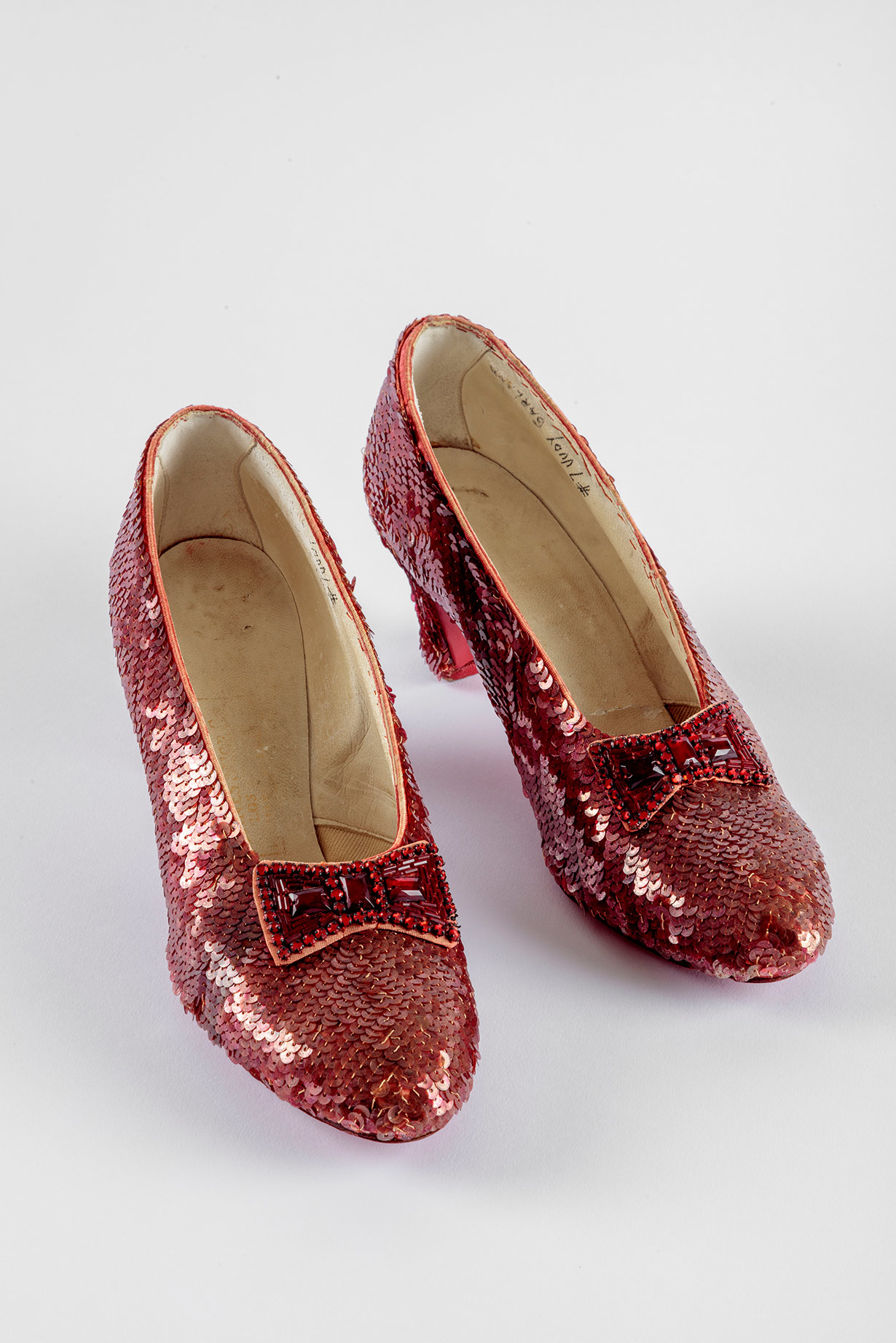 Screen-used close-up pair of the Ruby Slippers, designed by Adrian, from <i>The Wizard of Oz</i> (1939). Academy Museum of Motion Pictures. Photo by Joshua White, JWPictures/©Academy Museum Foundation