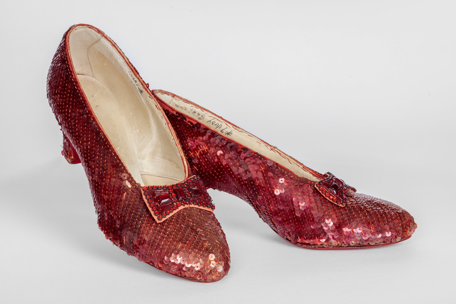 Screen-used close-up pair of the Ruby Slippers, designed by Adrian, from "The Wizard of Oz" (1939). Academy Museum of Motion Pictures. Photo by Joshua White, JWPictures/©Academy Museum Foundation