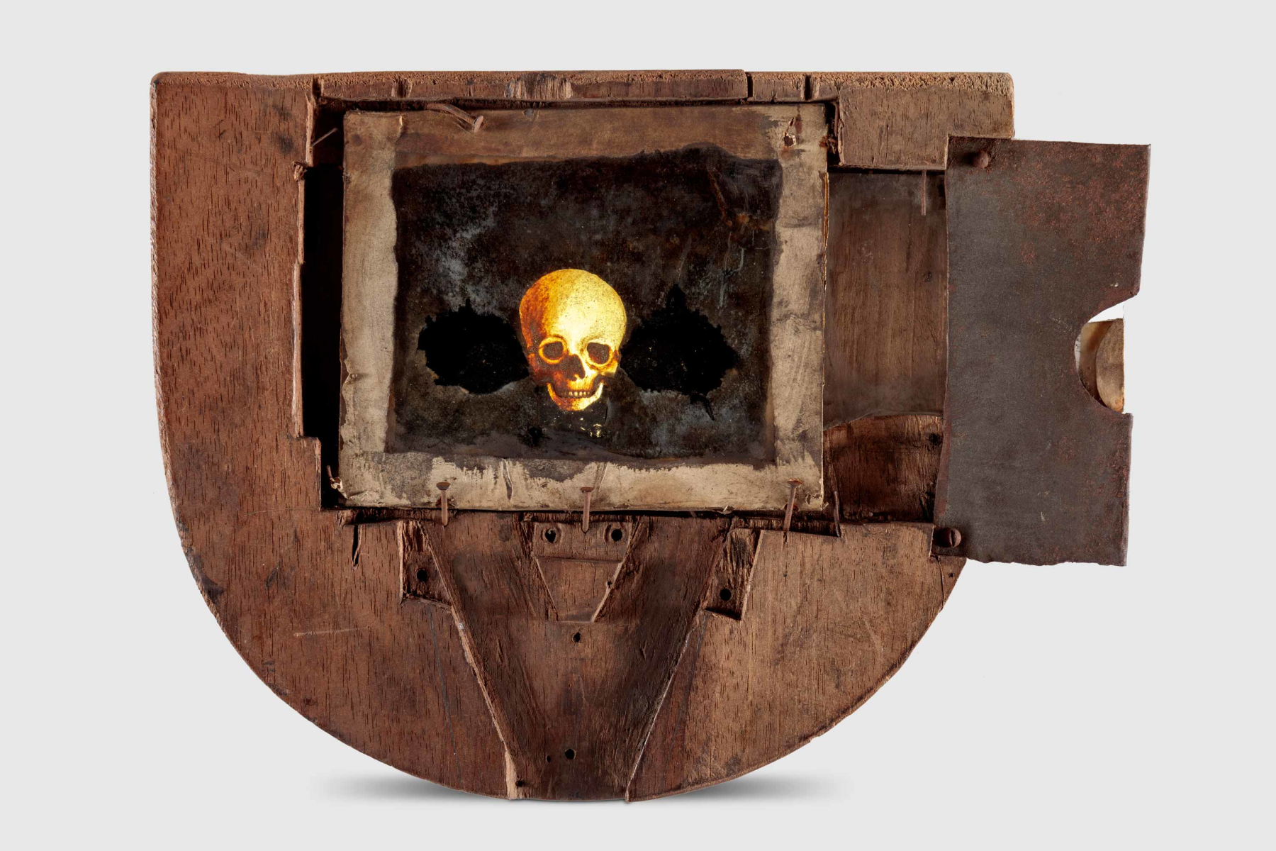 Phantasmagoria magic lantern slide depicting skull, Gift of Akram Miknas, and Museum Purchase, ©Academy Museum Foundation, Photo by Joshua White Photography/JW Pictures.