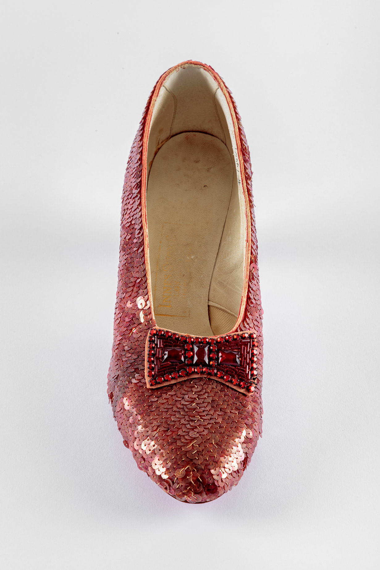 Screen-used close-up pair of the Ruby Slippers, designed by Adrian, from "The Wizard of Oz" (1939). Academy Museum of Motion Pictures. Photo by Joshua White, JWPictures/©Academy Museum Foundation